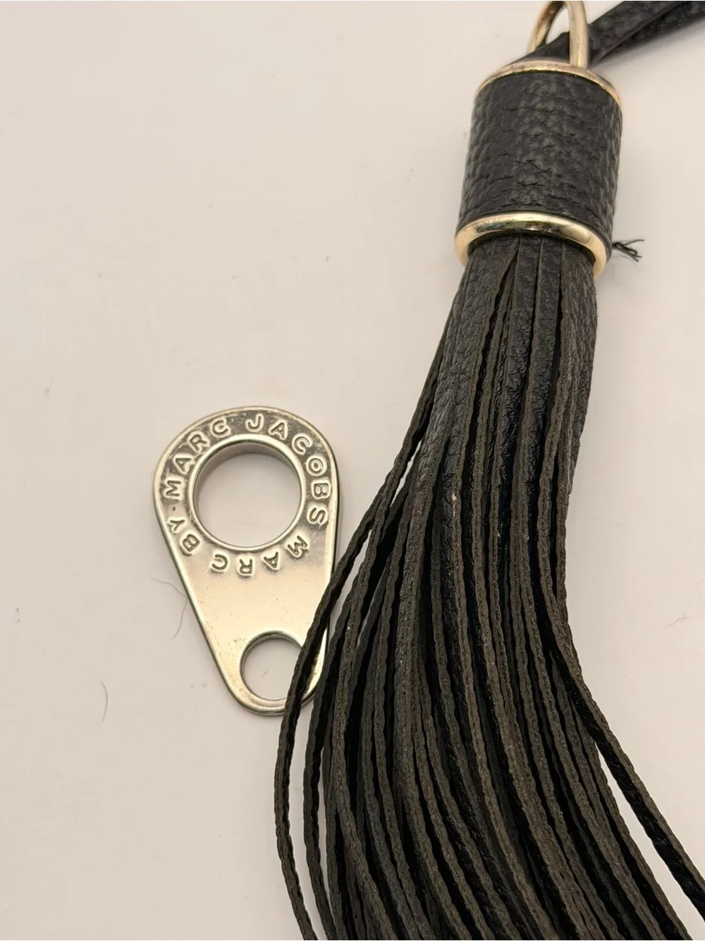Marc Jacob’s Tassel and Zipper Pull, very good, black